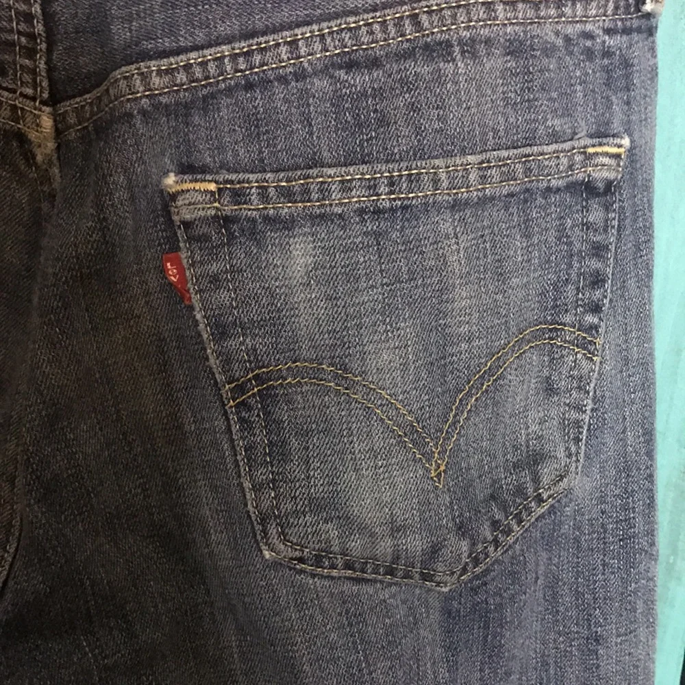 Levi’s 501 button fly Jeans size 35x28 (tag size 36x34) lightly distressed